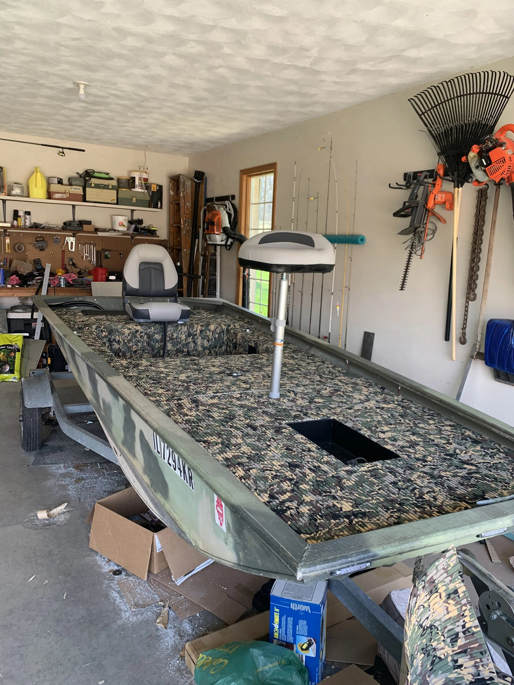 Custom aluminum boat deck with dark grey EVA foam traction pads on a trailer.