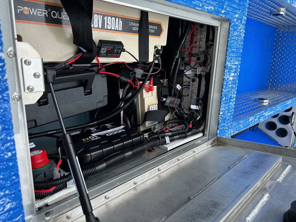 Aluminum Jon boat conversion with blue EVA foam flooring, Millennium seat, and trolling motor.