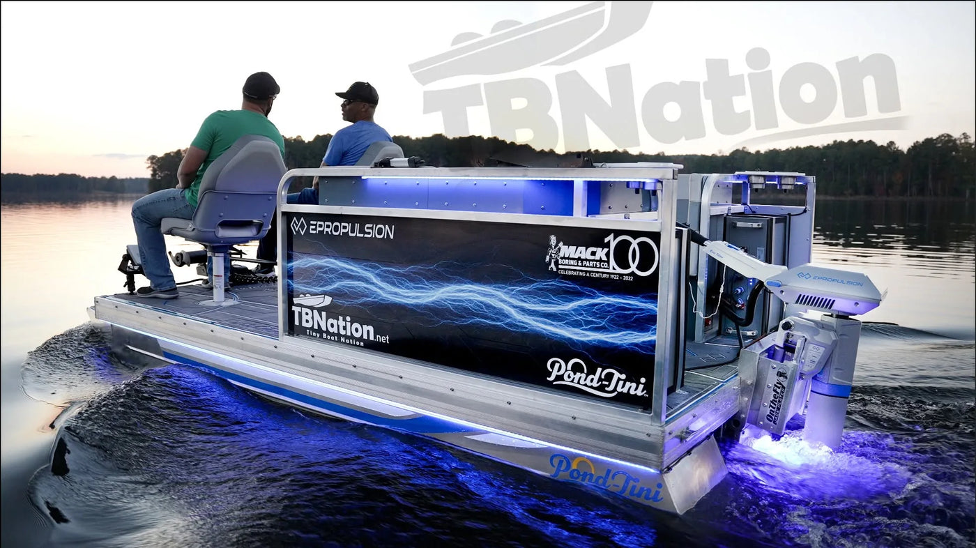 TBNation custom electric pontoon boat powered by an ePropulsion outboard motor, cruising on a lake with premium marine upgrades, LED lighting, and high-performance boating technology.