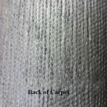 Close-up of the textured, durable black marine-grade boat carpet backing.