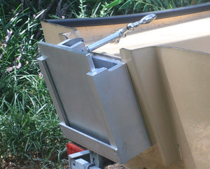 Silver aluminum OnTheFly Manual Jackplate installed on a boat transom with a chrome handle.