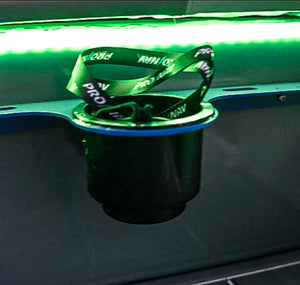 Green Plashlight 12V RGBW flexible light strip illuminating a black cup holder with a blue rim.