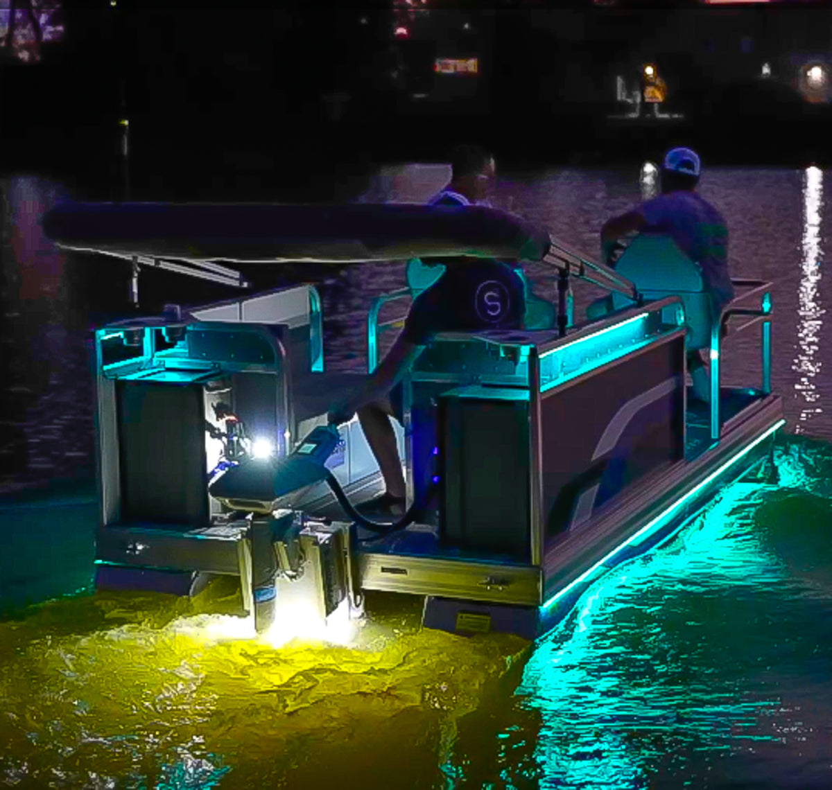 Plashlights EPIK underwater transom lights illuminating a boat with vibrant blue and yellow glow.