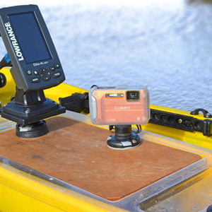 Railblaza Camera Mount Adapter with a Lumix camera attached, mounted on a wooden board on a yellow kayak.