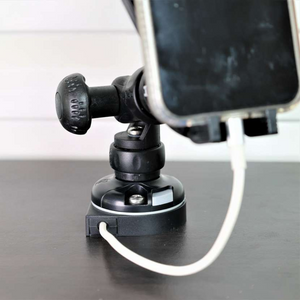 Black Railblaza E Series Cable Entry Port Base with a white cable, supporting a phone mount.