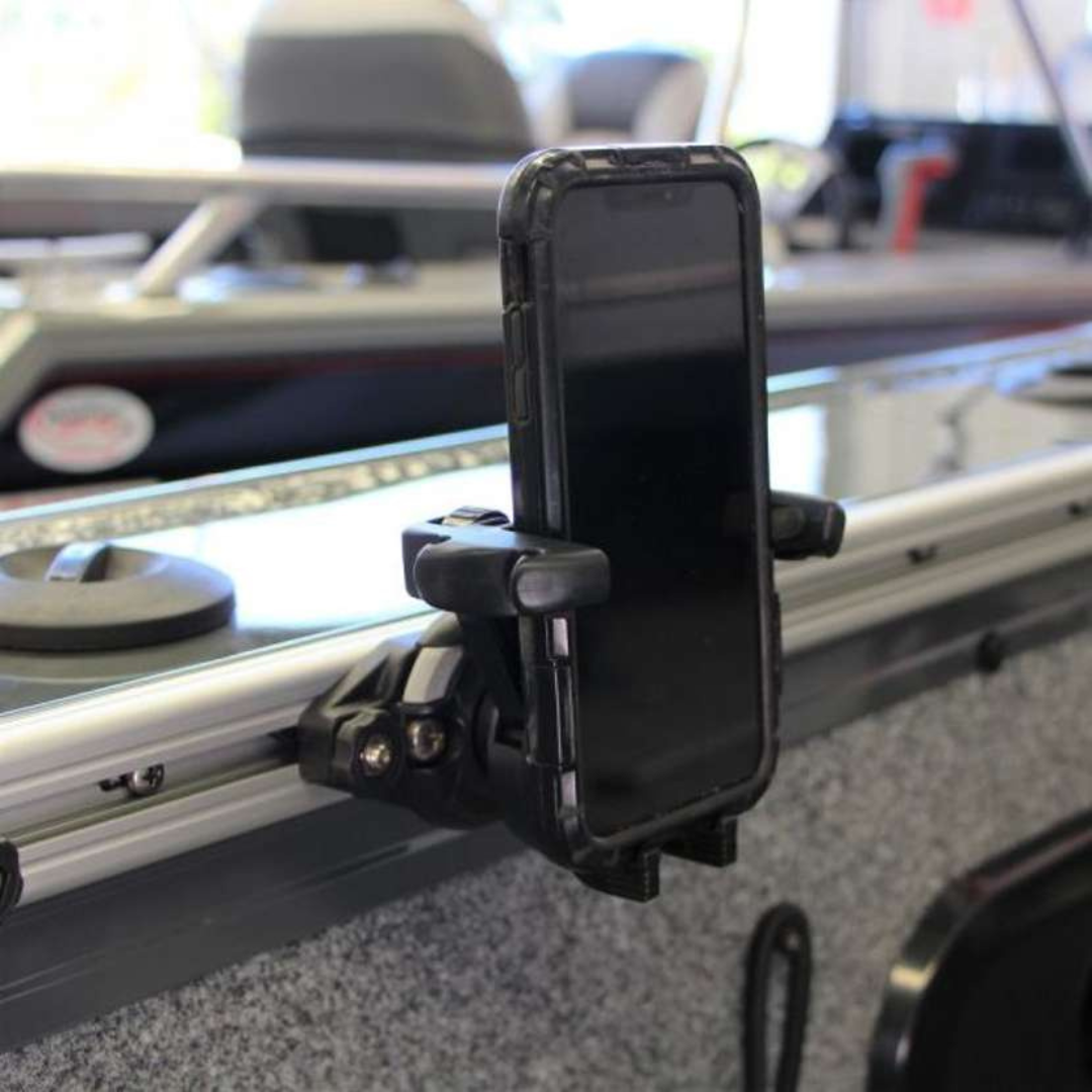 Railblaza TracLoader Gunnel Track with a black smartphone holder attached to a boat's gunnel.