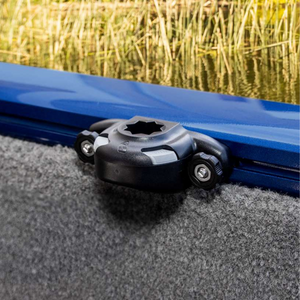Black Railblaza Trackloader Sideport boat accessory mounted on a blue gunnel track, with a grey carpeted boat interior.