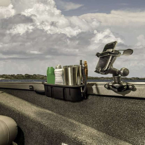 Black Railblaza Trackloader StarPort with phone holder and storage caddy mounted on a boat gunnel.