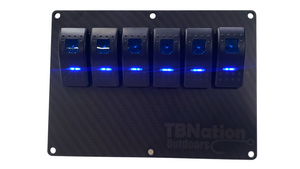 TBNation 6-gang carbon fiber hydro-dipped aluminum switch panel with six blue LED rocker switches.
